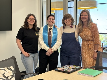 Asa Baker with their thesis committee. From left to right: Rachel Herz-Betz; Asa Baker; Molly Appel (advisor); Laura Decker.